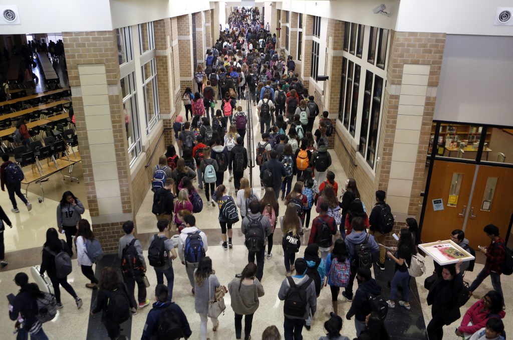 Students crowd the hallway after the last bell rings at Liberty High School in Frisco. Photo/Lara Solt