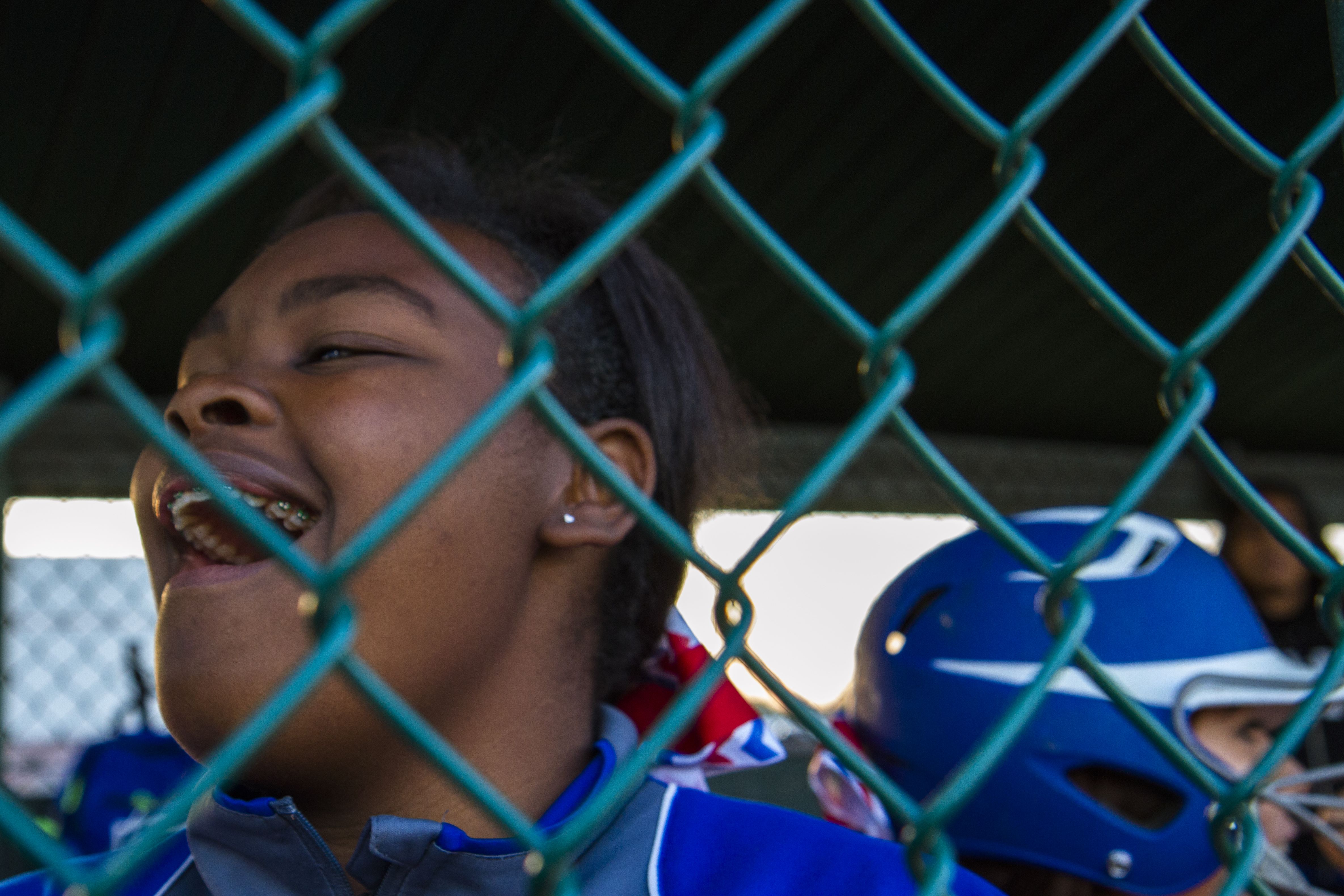 Rykevia "Rocky" Branch cheers on the Duncanville varsity softball team from the dugout.