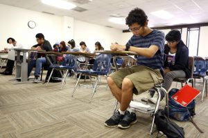 Joel Luera takes a quiz during a history class at Eastfield College Campus where he takes classes as part of W.W. Samuell Early College High School in Dallas. Photographed Monday, April 18, 2016. (photo © Lara Solt)