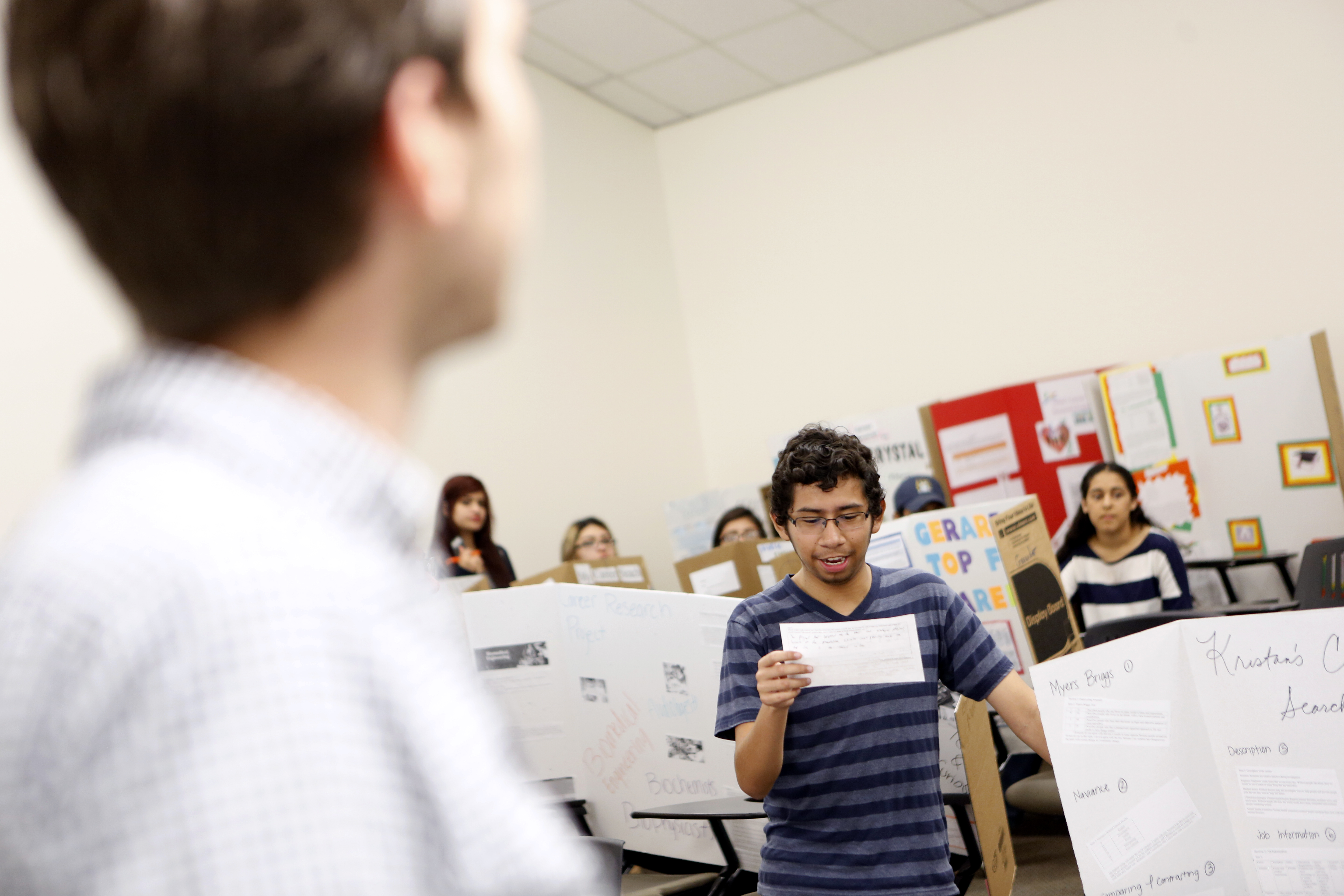 Joel Luera discusses his favorite career research project during a Pathways to College class led by DISD teacher Jonathan Martin (left) at Eastfield College Campus where he takes classes as part of W.W. Samuell Early College High School in Dallas. Photographed Monday, April 18, 2016. (photo © Lara Solt)