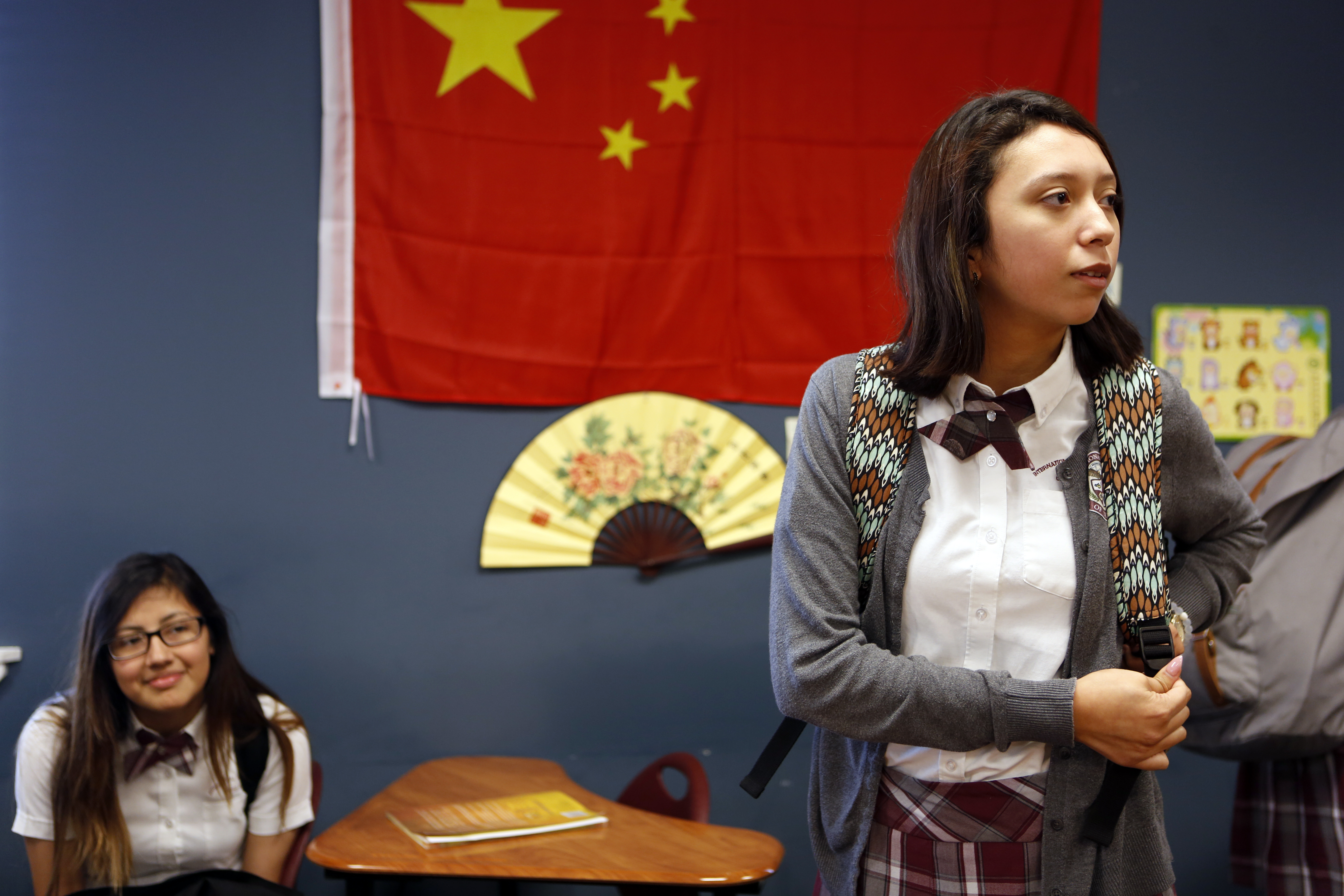 Alex Gutierrez, right, and Olga Sandoval wait for the bell to ring in their Mandarin Chinese class at International Leadership of Texas Garland High School. Photo/Lara Solt