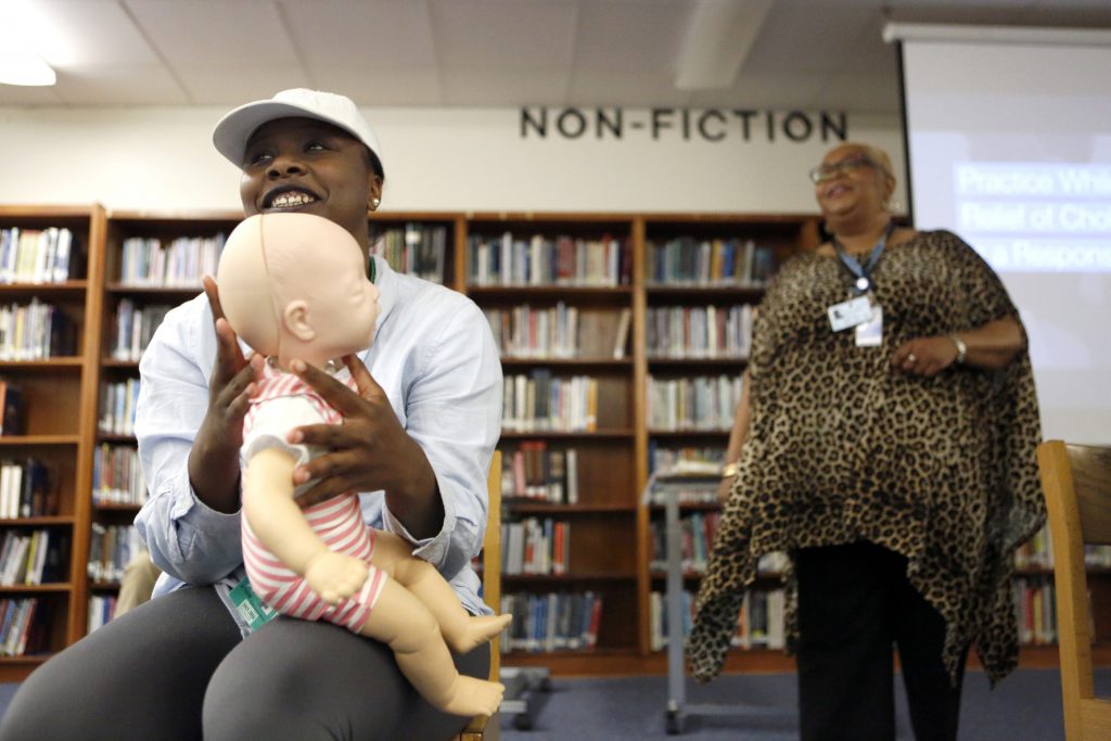 Kelli Bowdy practices infant choking rescue on a mannequin in the Nursing Assistance Program as part of the Health Science and Technology Program of Choice at O. D. Wyatt High School in Fort Worth, Texas. Photographed Monday, April 25, 2016. (photo © Lara Solt)