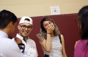 Alexandria Gutierrez laughs with Anthony Banuelos (left) and other friends while attending a senior banquet at International Leadership of Texas in Garland on Wednesday, May 25, 2017. (photo © Lara Solt)