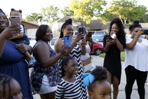 Kelli Bowdy's family takes pictures of her before she leaves for prom at her home in Forest Hill, Texas on Saturday, May 13, 2017. (photo © Lara Solt)