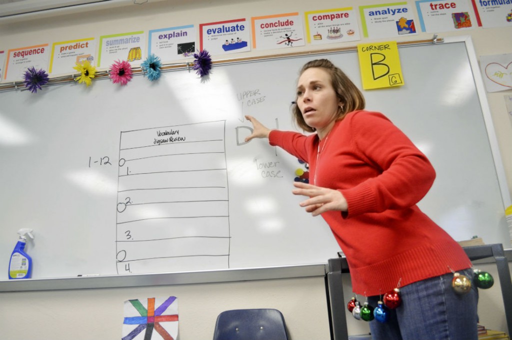Jaclynn Satilli, a teacher at International Newcomer Academy, explains a vocabulary exercise to her sixth graders. Photo/Christina Ulsh