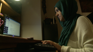 Irum Ali, at home on her computer, says she hopes to change some people's views on Islam. Photo/Mark Birnbaum