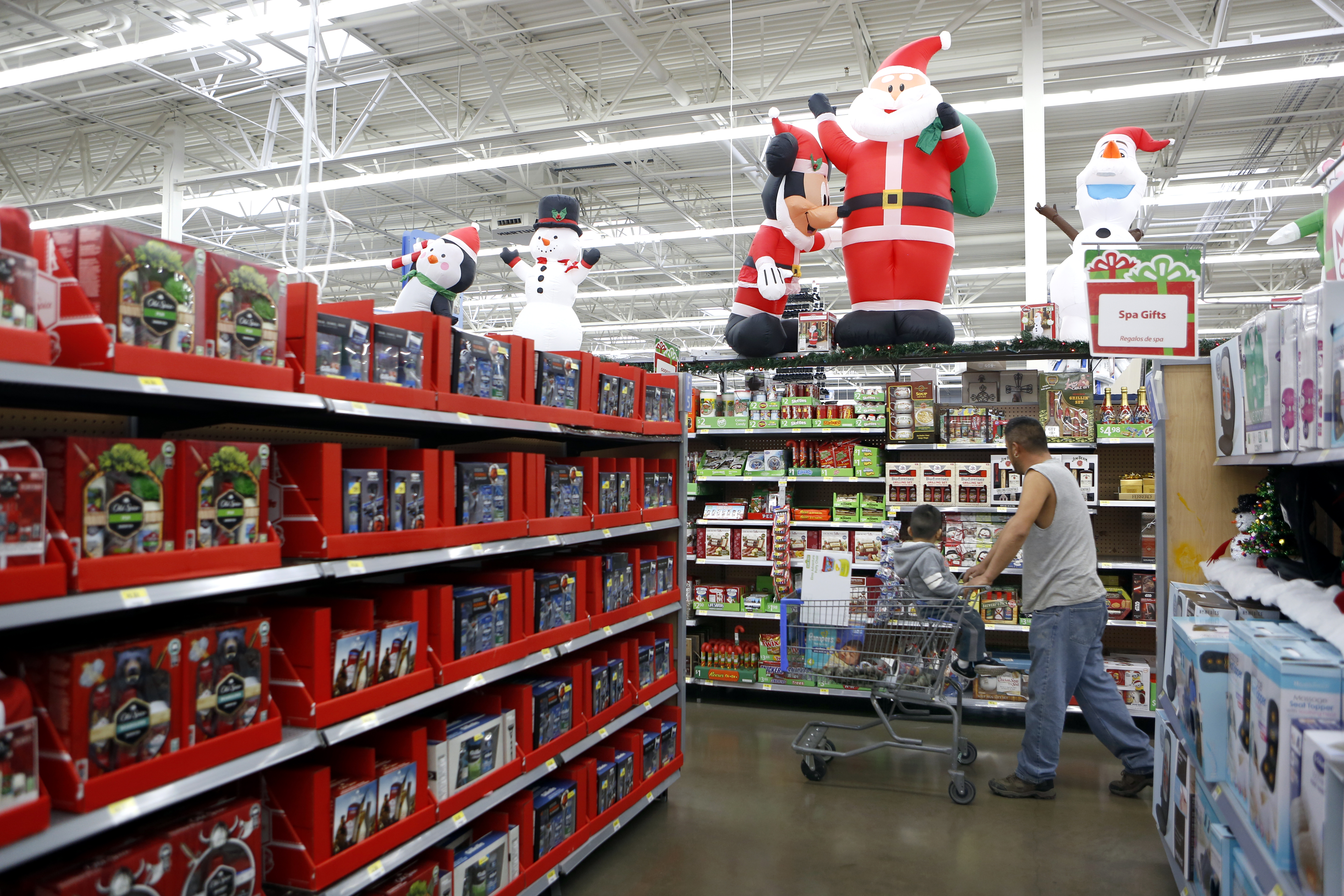 Shoppers walk through Christmas aisles at Walmart in Dallas. Photographed on Monday, November 16, 2015. Photo/Lara Solt