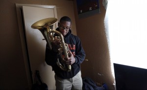 Desmond Davis, 18, admires his baritone, the instrument he plays in North Dallas High School's band. Photo/Lara Solt