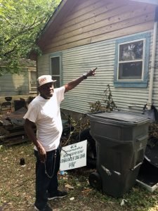 John Anderson outside his former West Dallas home. He visits the neighborhood often. Photo/Courtney Collins