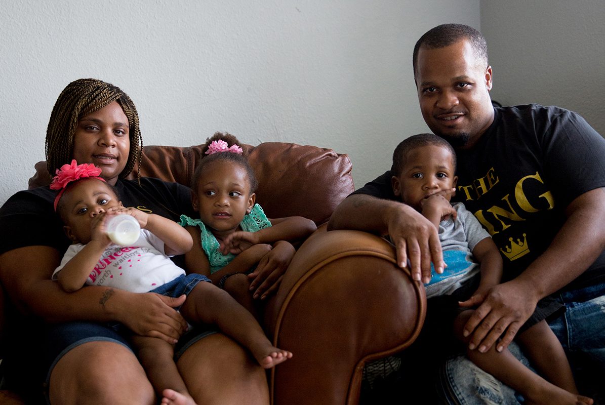 Stanley Walington with his girlfriend Lynette Sherman and their children Honesty, 1; Promiss, 3; and Stanley, 2; in their apartment in Fort Worth. 