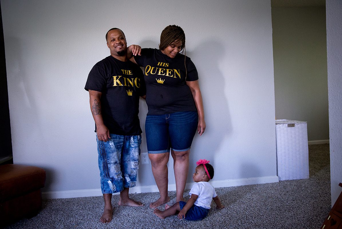 Honesty, 1, joins her parents, Stanley Walington and Lynette Sherman, for a picture in their apartment in Fort Worth. 