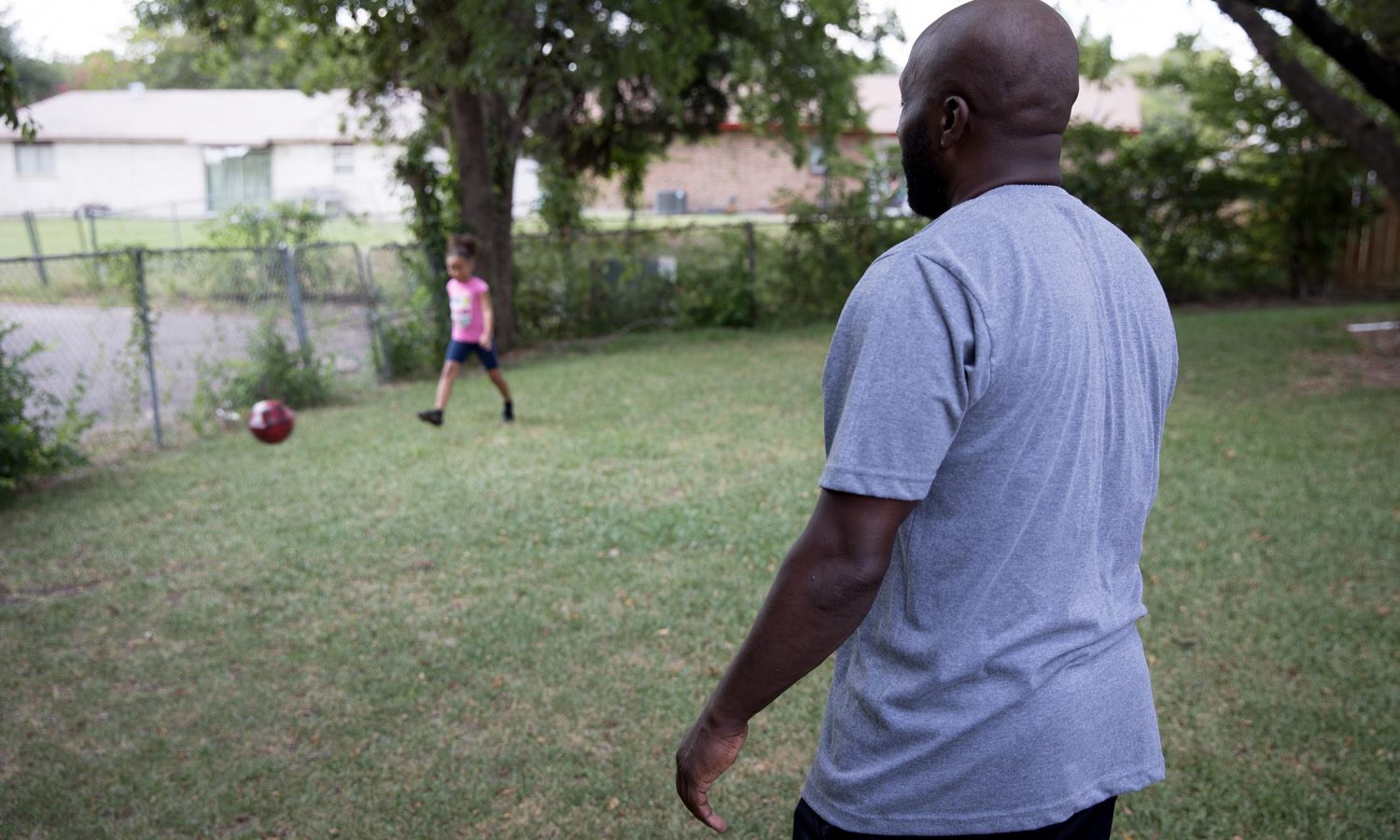 Marc Wilson plays with his granddaughter. Part of the One Crisis Away: Price of Prison series.