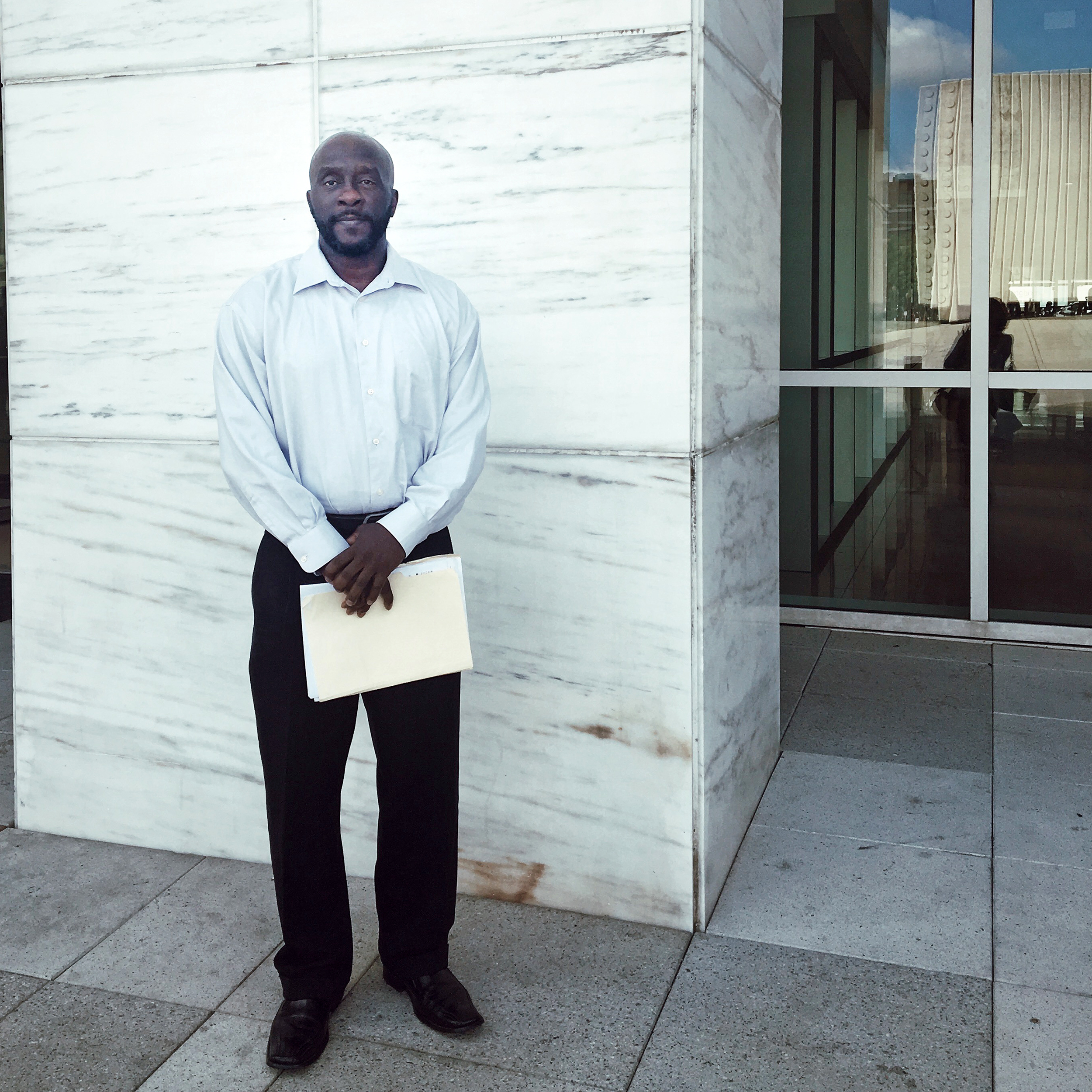Marc Wilson stands outside the George L. Allen, Sr. Courts Building in downtown Dallas on Sept. 10, 2019. / Photo: Courtney Collins, KERA