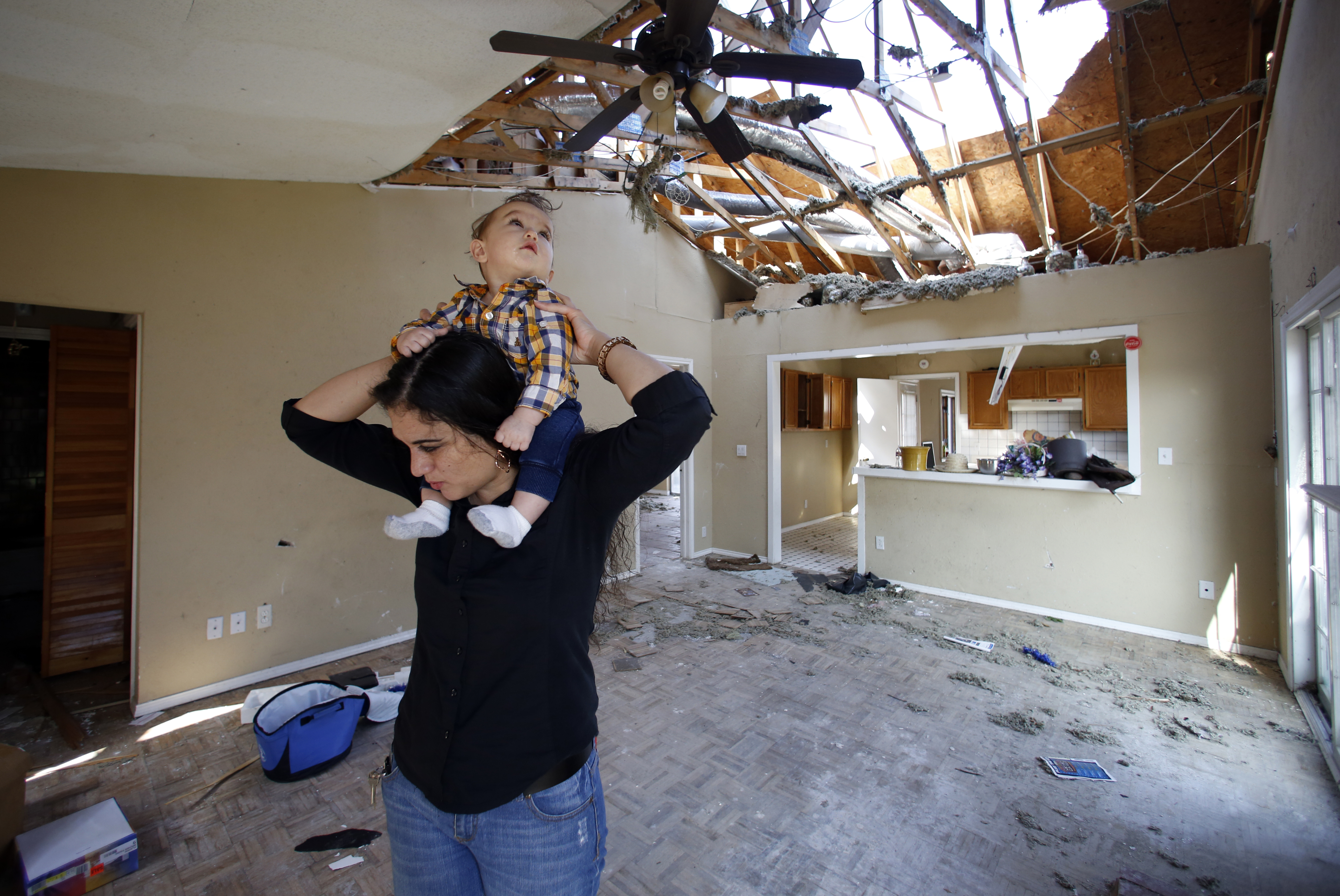 Lindsay Diaz and her son, 7-month-old Arian Krasniqui, in the living room of their Rowlett home. Photographed Friday, February 19, 2016. Photo/Lara Solt